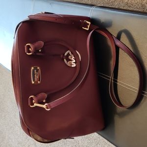 MK burgundy bag with crossbody strap